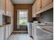 Laundry room with built-in cabinets and a window at 101 Hidden Cove Dr, Shelby, NC 28150