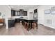 Modern kitchen with dark cabinets and granite island at 1707 Scarbrough Sw Cir, Concord, NC 28025