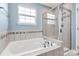 Spa-like bathroom with soaking tub and glass shower enclosure at 1707 Scarbrough Sw Cir, Concord, NC 28025