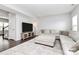 Living room with sectional sofa, hardwood floors, and TV at 1707 Scarbrough Sw Cir, Concord, NC 28025