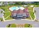 Aerial view of community pool, clubhouse, and playground at 1707 Scarbrough Sw Cir, Concord, NC 28025