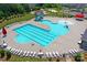 Community pool with lap lanes, spray park and lounge chairs at 1707 Scarbrough Sw Cir, Concord, NC 28025