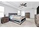 Spacious main bedroom with carpeted floors and ceiling fan at 1707 Scarbrough Sw Cir, Concord, NC 28025