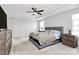 Main bedroom with plush carpet and ceiling fan at 1707 Scarbrough Sw Cir, Concord, NC 28025