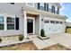 House exterior showcasing front door and garage at 1707 Scarbrough Sw Cir, Concord, NC 28025