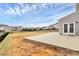 Large backyard patio and view of neighboring homes at 1707 Scarbrough Sw Cir, Concord, NC 28025