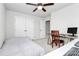 Bedroom with a bed, desk, and double doors at 1707 Scarbrough Sw Cir, Concord, NC 28025