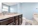 Bathroom with double vanity, granite countertop and soaking tub at 1707 Scarbrough Sw Cir, Concord, NC 28025