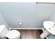 Small powder room with pedestal sink and toilet at 1707 Scarbrough Sw Cir, Concord, NC 28025