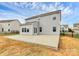 Home's backyard with large patio and fenced yard at 1707 Scarbrough Sw Cir, Concord, NC 28025