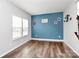 Bright dining room with hardwood floors and neutral walls at 1707 Scarbrough Sw Cir, Concord, NC 28025