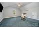 Spacious bonus room with ceiling fan, carpet, and window at 28399 Flint Ridge Rd, Albemarle, NC 28001