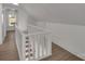 Upper hallway with white walls and light wood flooring, leading to bedrooms at 4315 Gibbon Rd, Charlotte, NC 28269