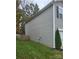 Gray vinyl siding house exterior with a wooden fence and grassy yard at 5835 Natick Dr, Charlotte, NC 28214