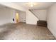 Unfinished basement with vinyl flooring and access to a bathroom at 82 Allen Pond Rd, Wadesboro, NC 28170