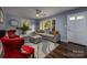 Living room with gray sofa and red accent chairs at 913 Second St, Spencer, NC 28159