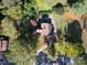 House with a driveway and a large backyard surrounded by trees at 1116 E Franklin Blvd, Gastonia, NC 28054