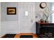 Elegant entryway with white door, wood floors, and decorative accents at 1116 E Franklin Blvd, Gastonia, NC 28054