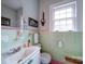 Light and airy bathroom with mint green tile at 1116 E Franklin Blvd, Gastonia, NC 28054