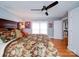 Spacious bedroom with hardwood floors, large windows, and a ceiling fan at 1116 E Franklin Blvd, Gastonia, NC 28054