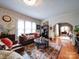 Spacious living room with hardwood floors, fireplace, and access to dining area at 1116 E Franklin Blvd, Gastonia, NC 28054