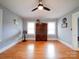 Well lit bedroom with hardwood floors, ceiling fan and large windows at 1116 E Franklin Blvd, Gastonia, NC 28054
