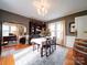 Formal dining room with hardwood floors, chandelier, and built-in hutch at 1116 E Franklin Blvd, Gastonia, NC 28054