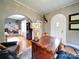 Home office with a wooden desk and view of the dining room at 1116 E Franklin Blvd, Gastonia, NC 28054