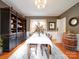 Formal dining room with hardwood floors, a large hutch, and a wine barrel at 1116 E Franklin Blvd, Gastonia, NC 28054