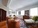 Open living room with hardwood floors, featuring a neutral color scheme at 1116 E Franklin Blvd, Gastonia, NC 28054