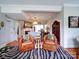 Spacious living room with two leather chairs and a zebra print rug at 1116 E Franklin Blvd, Gastonia, NC 28054