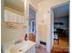 Bathroom with a pedestal sink and access to other rooms at 1116 E Franklin Blvd, Gastonia, NC 28054