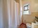 Clean bathroom with a shower/tub and stained glass window at 1116 E Franklin Blvd, Gastonia, NC 28054