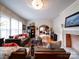 Bright living room with hardwood floors, a fireplace, and access to the dining area at 1116 E Franklin Blvd, Gastonia, NC 28054