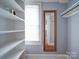 Large closet with built-in shelving and a window at 1116 E Franklin Blvd, Gastonia, NC 28054