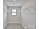 Spacious walk-in closet with wire shelving at 115 Ciara Pl # E, Mooresville, NC 28117