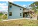 Two story light blue house with deck and backyard at 1150 Hearth Sw Ln, Concord, NC 28025