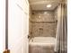 Bathroom with tub and shower, tile surround at 1740 Fairway Dr, Newton, NC 28658