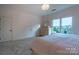 Bright bedroom with large window and view at 17418 Sailors Watch Pl, Cornelius, NC 28031
