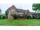 Brick house with deck and landscaped yard at 17418 Sailors Watch Pl, Cornelius, NC 28031