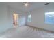 Bright bedroom with carpet, ceiling fan, and access to a bathroom at 17418 Sailors Watch Pl, Cornelius, NC 28031