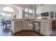 Open concept kitchen with marble countertops and island at 17418 Sailors Watch Pl, Cornelius, NC 28031