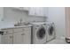 Laundry room with washer, dryer and utility sink at 17418 Sailors Watch Pl, Cornelius, NC 28031