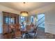 Formal dining room with hardwood floors, large table, and chandelier at 17418 Sailors Watch Pl, Cornelius, NC 28031