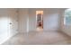 Spacious bedroom with carpet, neutral walls, and access to another bedroom at 17418 Sailors Watch Pl, Cornelius, NC 28031