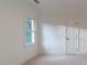 Simple bedroom with carpet, neutral walls, a window, and a door at 17418 Sailors Watch Pl, Cornelius, NC 28031