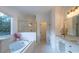 Bright bathroom with soaking tub, shower and double vanity at 17418 Sailors Watch Pl, Cornelius, NC 28031