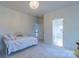 Bedroom with daybed and access to a small bathroom at 17418 Sailors Watch Pl, Cornelius, NC 28031