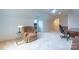 Bonus room with a comfy chair, built in cabinets and mini fridge at 17418 Sailors Watch Pl, Cornelius, NC 28031