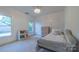 Bedroom with a daybed, dresser, and charming light fixture at 17418 Sailors Watch Pl, Cornelius, NC 28031